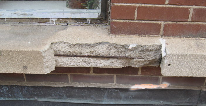 Distressed area at precast masonry window sill