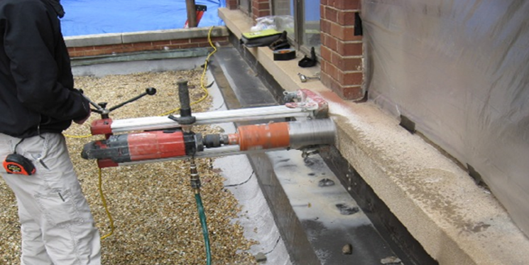 Coring Technician Obtains a Sample Specimen from a Representative Area